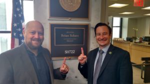 Tae Darnell and Ean Seeb stand outside of Senator Schatz's congressional office in D.C. 